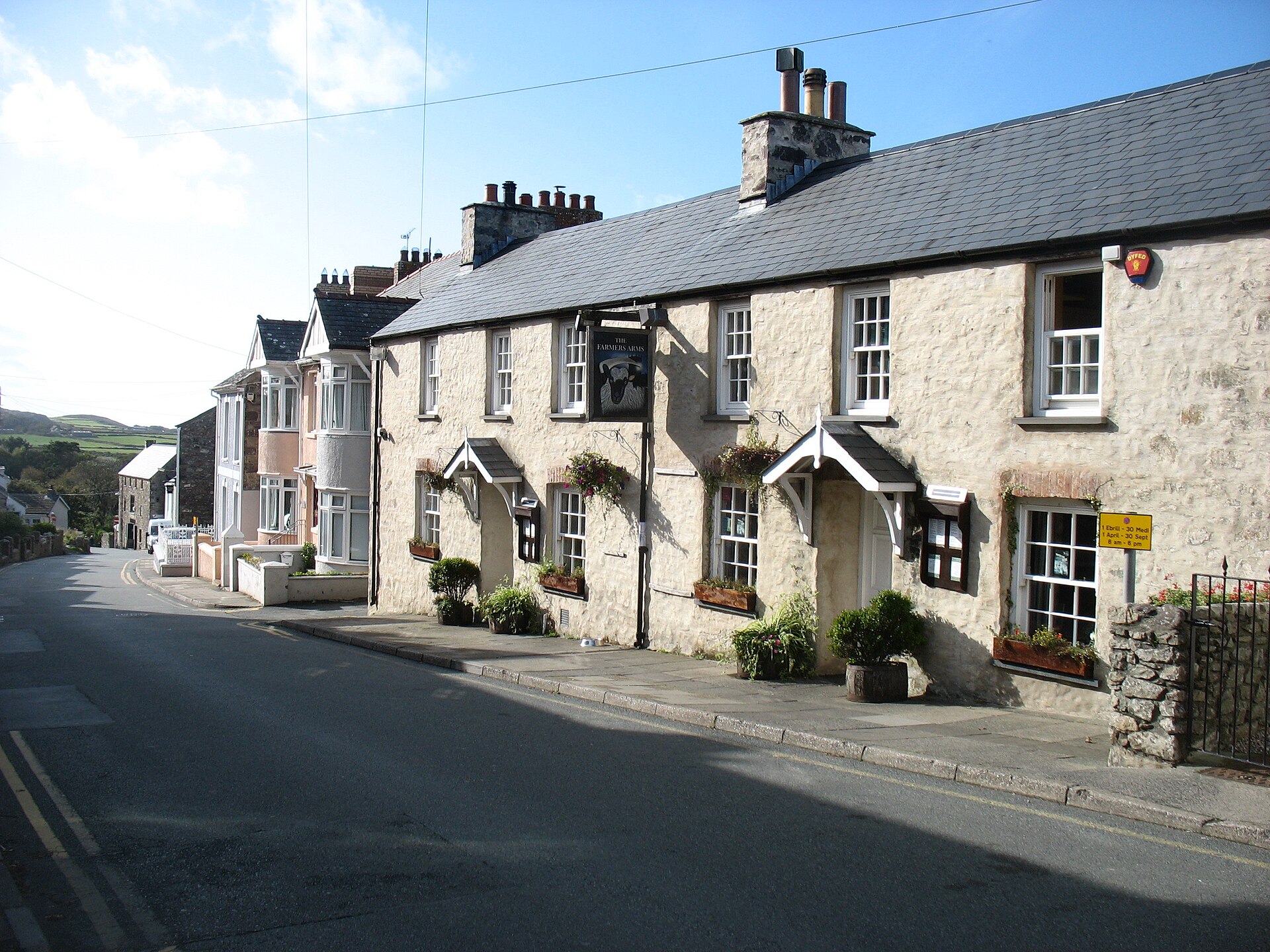 The Farmers Arms, a stone-built pub on Goat Street in St Davids, on a sunny day